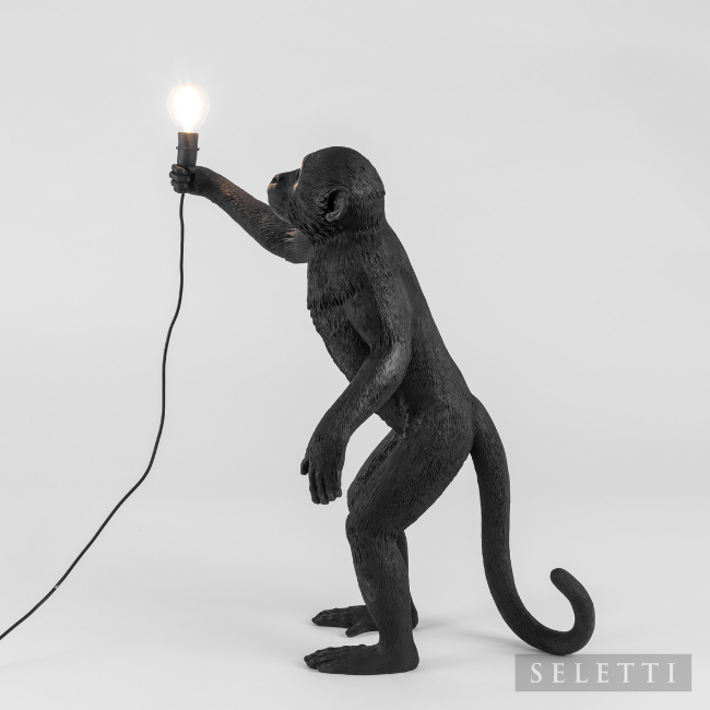black standing monkey lamp